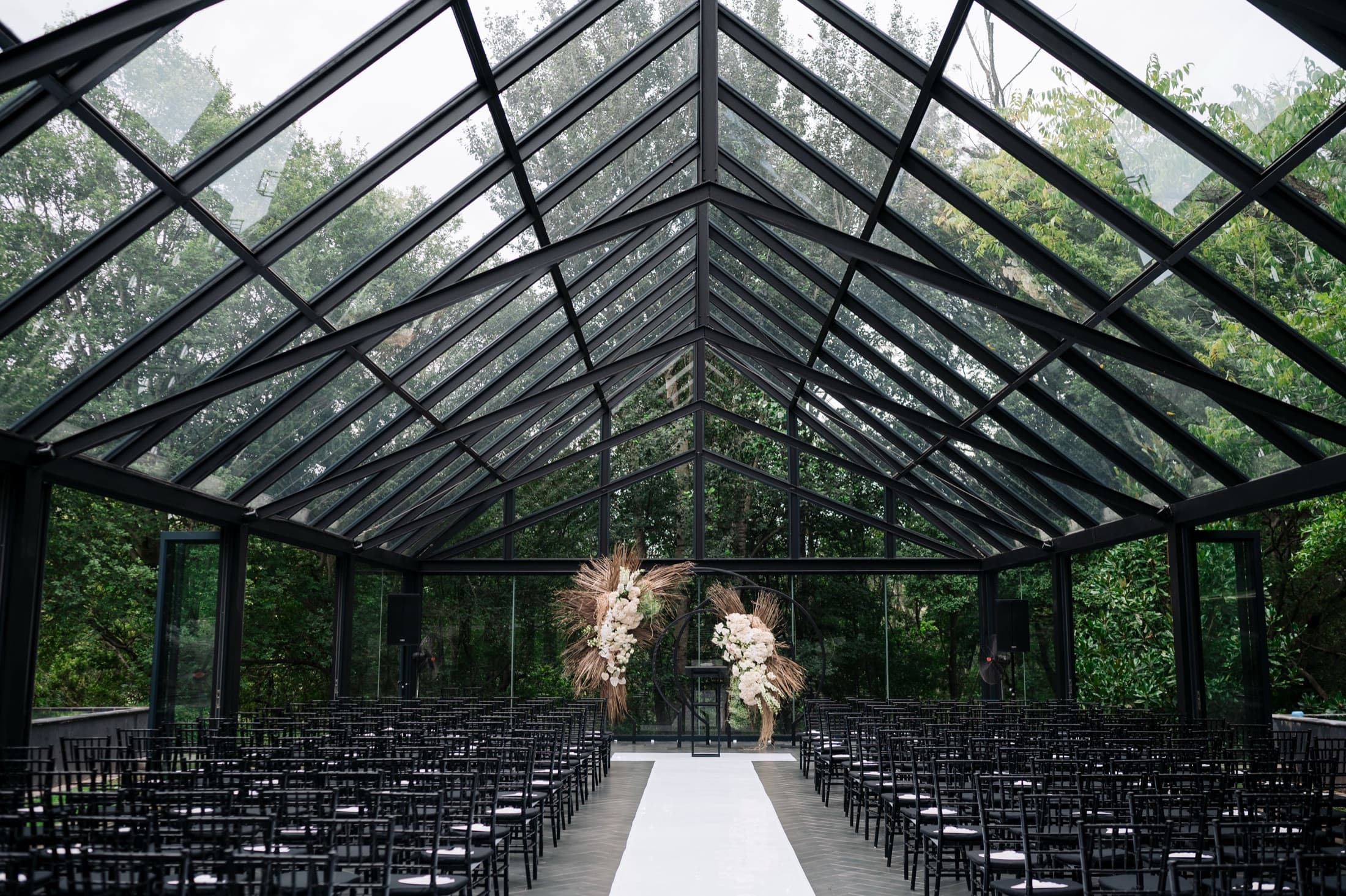 The glass chapel at Inimitable, set for a ceremony
